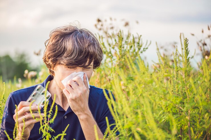 A boy is sneezing because of food allergy